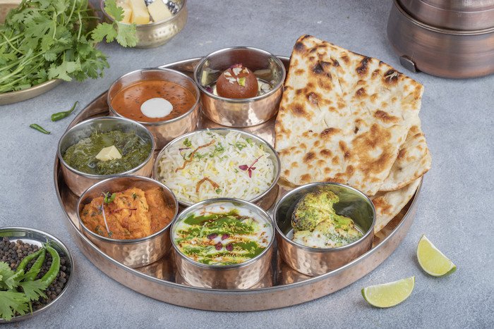 Dal Tadka, Paneer Sabzi, Bundi Rayta, Zeera Rice, Salad, Papad, 5 Chapati / 4Tandoori Roti